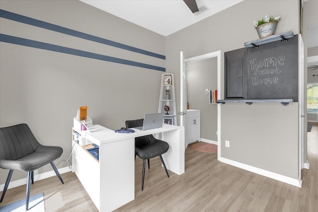 office area featuring baseboards and light wood-style floors