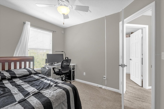 bedroom featuring baseboards, ceiling fan, and carpet