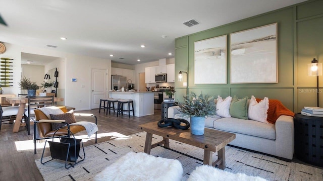 8375 Madrid St, Lakeland, FL 33810 - living room featuring recessed lighting, visible vents, and light wood-style flooring