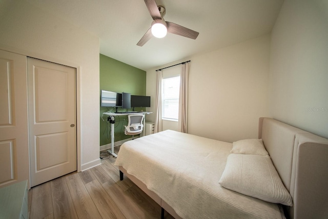 bedroom featuring a ceiling fan and wood finished floors