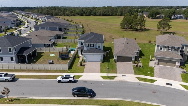 birds eye view of property with a residential view
