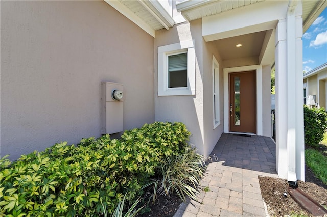 2423 Datura Loop, Saint Cloud, FL 34772 - property entrance with stucco siding