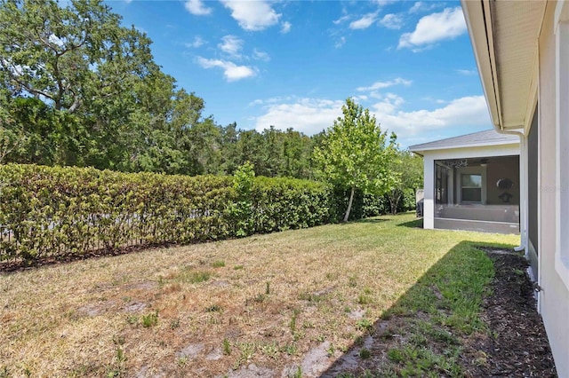 2423 Datura Loop, Saint Cloud, FL 34772 - view of grassy yard featuring a sunroom
