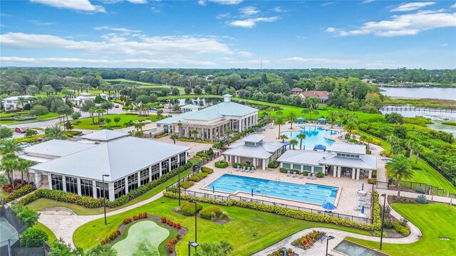 2423 Datura Loop, Saint Cloud, FL 34772 - bird's eye view of a pool area, a large body of water, and a tree filled landscape