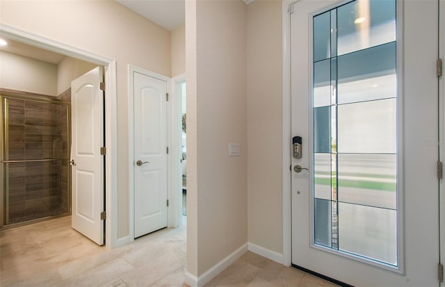 foyer entrance with baseboards