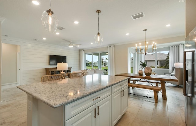 kitchen featuring visible vents and ornamental molding
