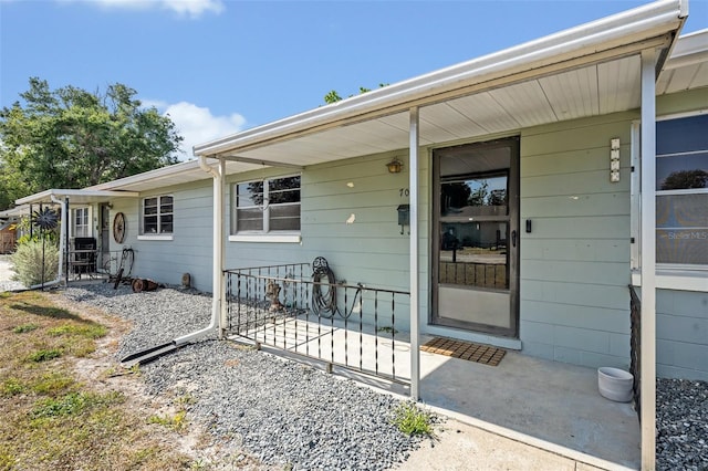 entrance to property featuring a patio area
