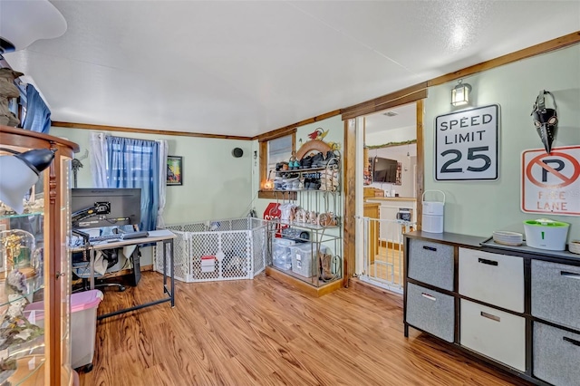 home office with light wood-style floors