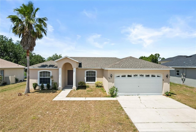 15 Sawfish Ln, Kissimmee, FL 34759 - single story home featuring stucco siding, driveway, a front lawn, and a garage
