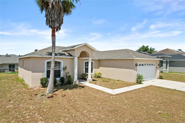15 Sawfish Ln, Kissimmee, FL 34759 - ranch-style home featuring a garage, stucco siding, driveway, and a front yard