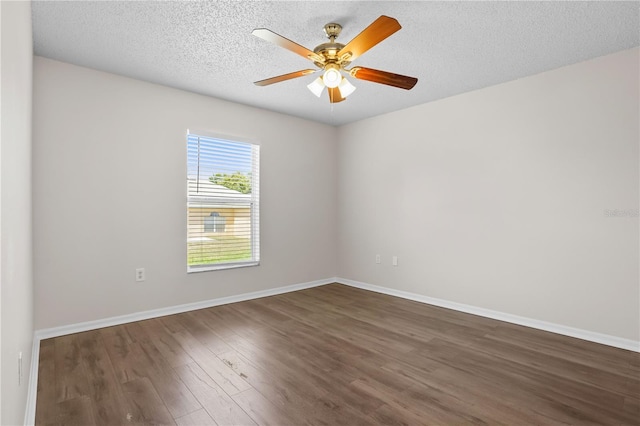 15 Sawfish Ln, Kissimmee, FL 34759 - spare room with baseboards, a ceiling fan, a textured ceiling, and wood finished floors