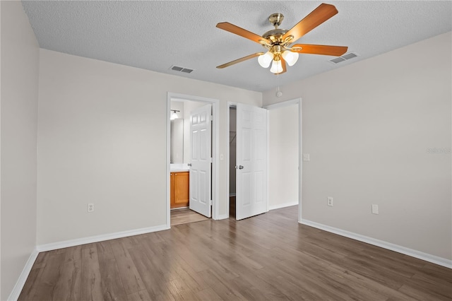 15 Sawfish Ln, Kissimmee, FL 34759 - unfurnished bedroom featuring baseboards, wood finished floors, and visible vents