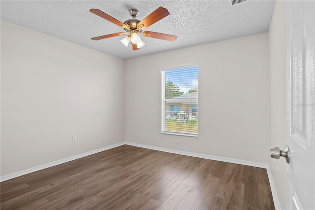 15 Sawfish Ln, Kissimmee, FL 34759 - spare room with a textured ceiling, baseboards, ceiling fan, and wood finished floors