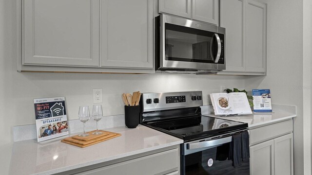 kitchen featuring stainless steel appliances and light countertops