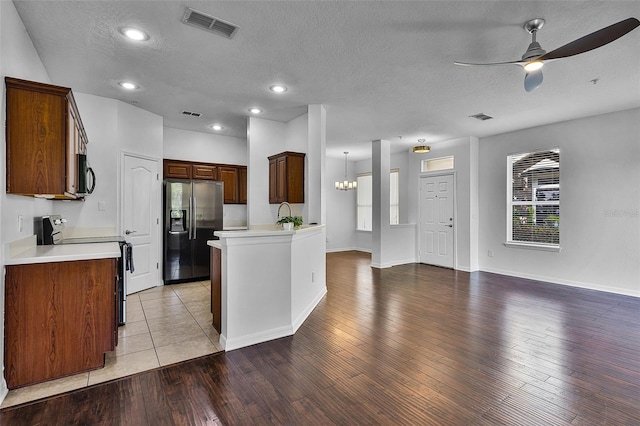 1821 San Jacinto Cir, Sanford, FL 32771 - kitchen featuring visible vents, open floor plan, a ceiling fan, light wood-style flooring, and appliances with stainless steel finishes