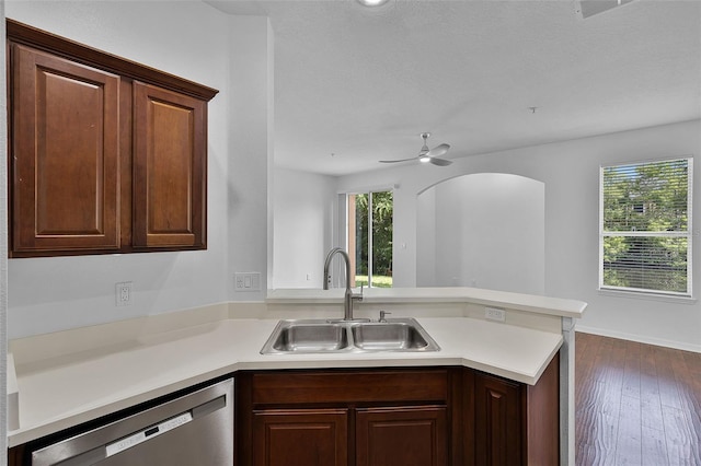 1821 San Jacinto Cir, Sanford, FL 32771 - kitchen with a sink, dishwasher, light countertops, dark wood finished floors, and a peninsula