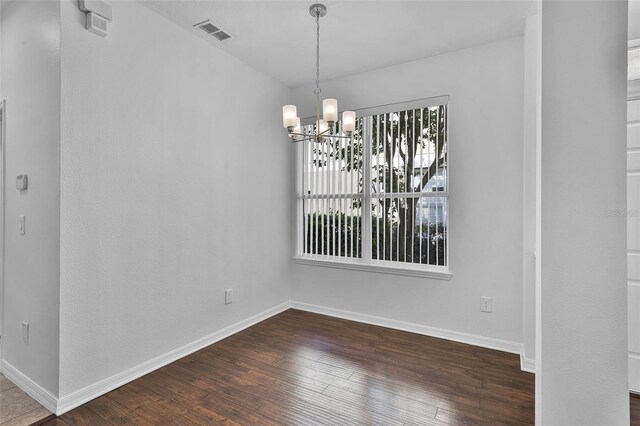 1821 San Jacinto Cir, Sanford, FL 32771 - unfurnished dining area featuring a chandelier, visible vents, a healthy amount of sunlight, and dark wood finished floors