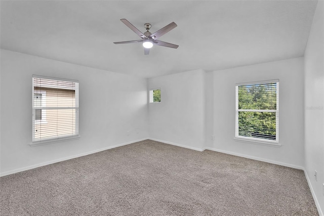 1821 San Jacinto Cir, Sanford, FL 32771 - spare room featuring carpet floors, a ceiling fan, baseboards, and a healthy amount of sunlight