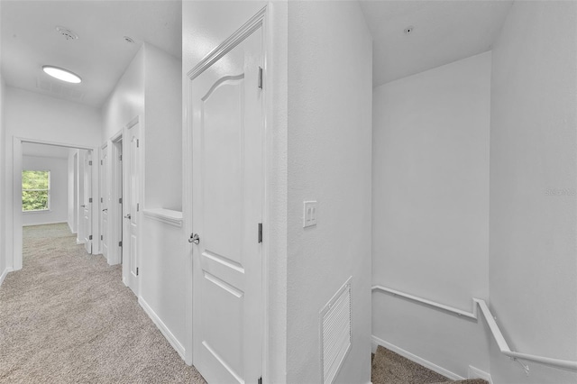 1821 San Jacinto Cir, Sanford, FL 32771 - corridor with carpet floors, baseboards, and an upstairs landing
