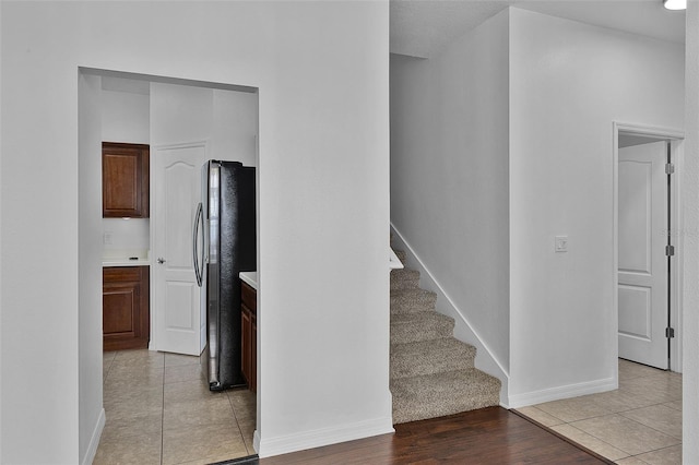 1821 San Jacinto Cir, Sanford, FL 32771 - staircase featuring baseboards and tile patterned floors