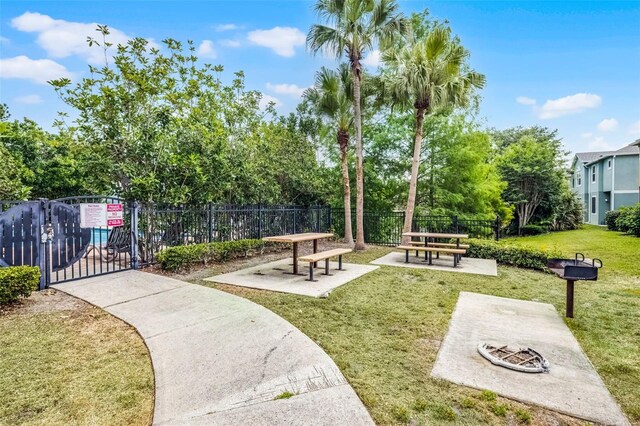 1821 San Jacinto Cir, Sanford, FL 32771 - view of home's community featuring a yard, fence, and a gate