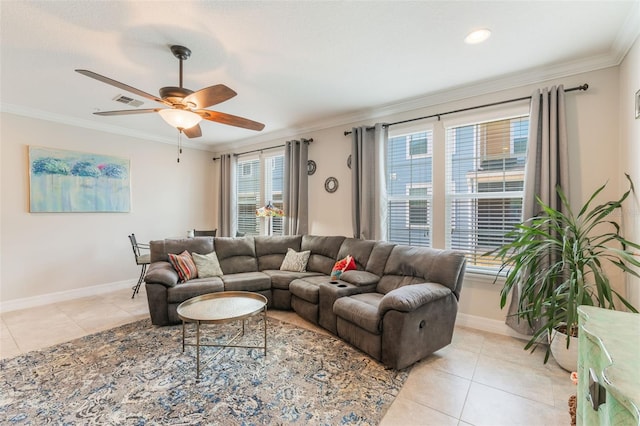 living room featuring light tile patterned flooring, ceiling fan, baseboards, visible vents, and ornamental molding