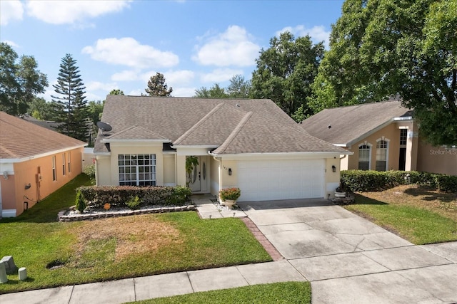342 Hanging Moss Cir, Lake Mary, FL 32746 - ranch-style house featuring concrete driveway, roof with shingles, stucco siding, a front lawn, and a garage