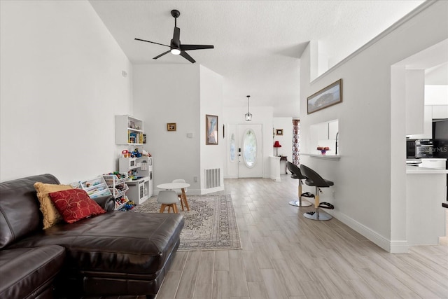 342 Hanging Moss Cir, Lake Mary, FL 32746 - living area featuring baseboards, visible vents, a ceiling fan, and light wood finished floors