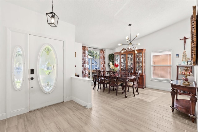 342 Hanging Moss Cir, Lake Mary, FL 32746 - entryway featuring a textured ceiling, a chandelier, light wood-style flooring, and baseboards