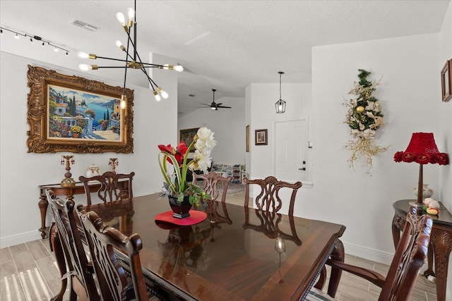 342 Hanging Moss Cir, Lake Mary, FL 32746 - dining space featuring baseboards, visible vents, ceiling fan with notable chandelier, and lofted ceiling