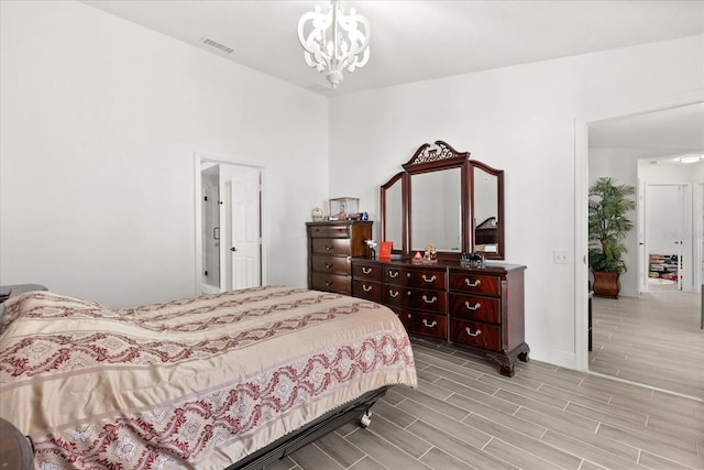 342 Hanging Moss Cir, Lake Mary, FL 32746 - bedroom with light wood-type flooring, visible vents, an inviting chandelier, and baseboards