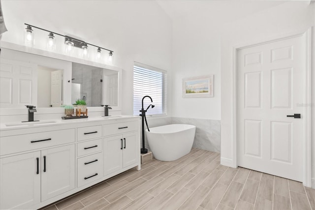342 Hanging Moss Cir, Lake Mary, FL 32746 - full bath featuring a stall shower, tile walls, a sink, and a freestanding bath