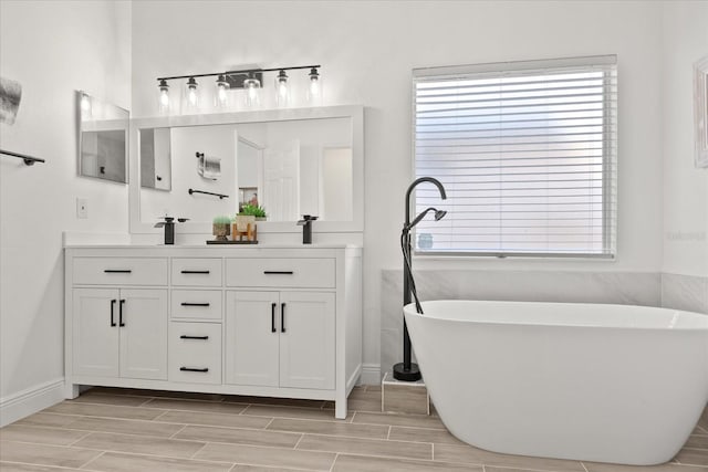 342 Hanging Moss Cir, Lake Mary, FL 32746 - bathroom with double vanity, a wealth of natural light, and baseboards