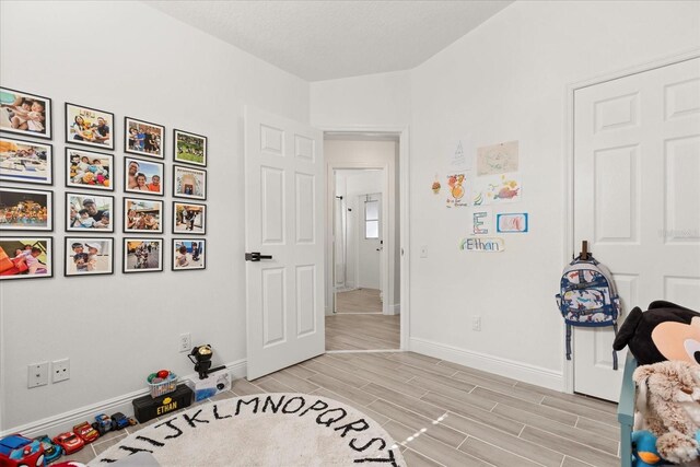 342 Hanging Moss Cir, Lake Mary, FL 32746 - bedroom featuring baseboards and wood tiled floor