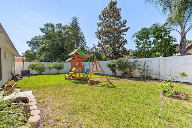 342 Hanging Moss Cir, Lake Mary, FL 32746 - view of yard featuring a fenced backyard, central AC unit, and a playground