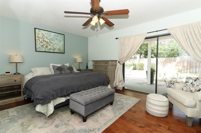 bedroom with access to outside, ceiling fan, and wood finished floors