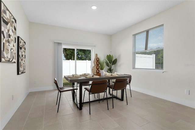dining area featuring recessed lighting and baseboards