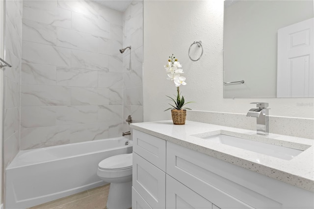 bathroom with vanity, toilet, tile patterned flooring, and tub / shower combination
