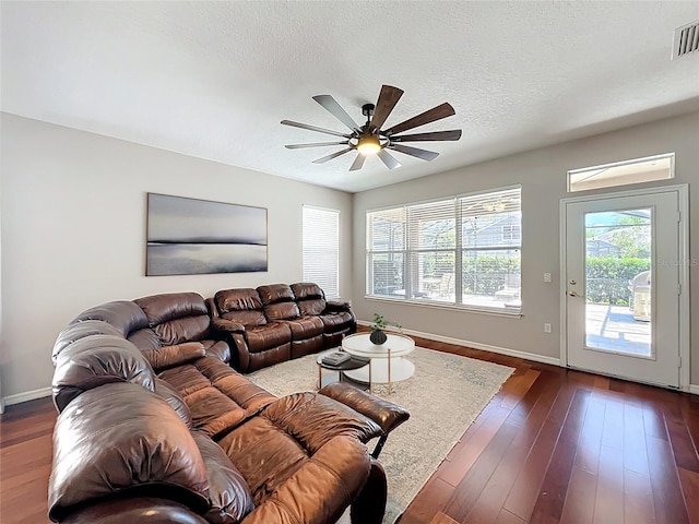 12724 Bideford Ave, Windermere, FL 34786 - living room with ceiling fan, dark wood-style floors, and a textured ceiling