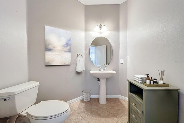 12724 Bideford Ave, Windermere, FL 34786 - half bath with toilet and tile patterned flooring