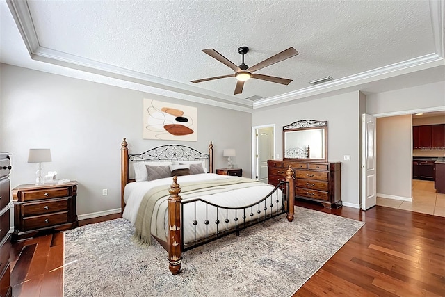 12724 Bideford Ave, Windermere, FL 34786 - bedroom featuring a raised ceiling, a textured ceiling, wood finished floors, and a ceiling fan