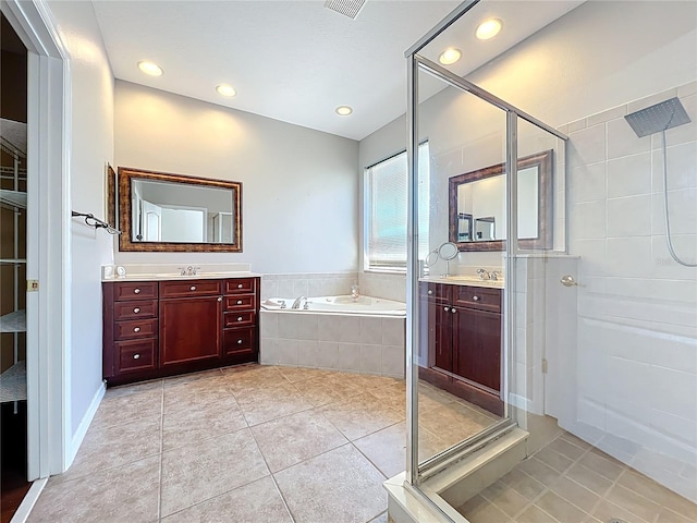 12724 Bideford Ave, Windermere, FL 34786 - full bathroom featuring a shower stall, a garden tub, tile patterned floors, two vanities, and recessed lighting