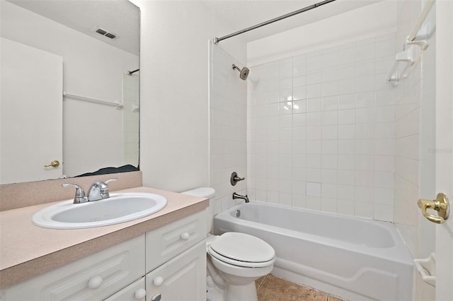 full bath with visible vents, vanity, tub / shower combination, toilet, and tile patterned floors
