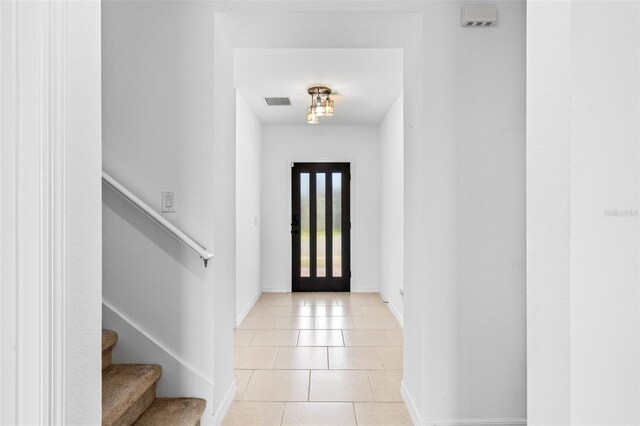683 Campo Ln, Davenport, FL 33837 - entryway featuring stairs, light tile patterned flooring, baseboards, and visible vents