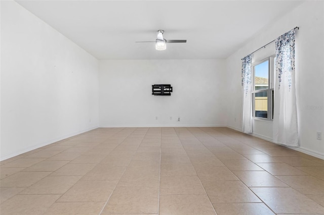 683 Campo Ln, Davenport, FL 33837 - spare room with light tile patterned floors, baseboards, and a ceiling fan