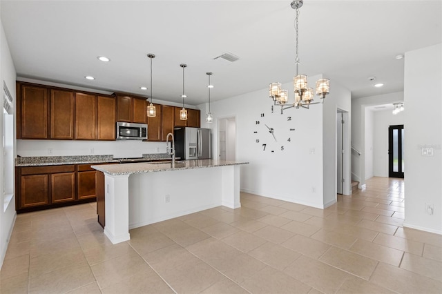 683 Campo Ln, Davenport, FL 33837 - kitchen featuring visible vents, appliances with stainless steel finishes, a sink, recessed lighting, and an island with sink