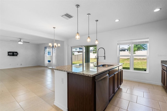 683 Campo Ln, Davenport, FL 33837 - kitchen with dark brown cabinetry, a sink, dishwasher, light tile patterned floors, and visible vents