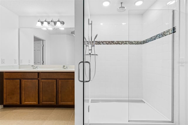 683 Campo Ln, Davenport, FL 33837 - full bathroom with tile patterned flooring, a sink, double vanity, and a shower stall
