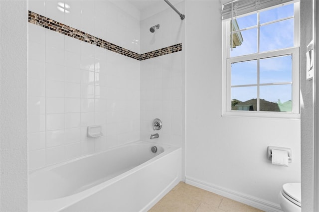 683 Campo Ln, Davenport, FL 33837 - full bath with baseboards, shower / bathing tub combination, toilet, and tile patterned flooring