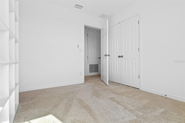 683 Campo Ln, Davenport, FL 33837 - unfurnished bedroom with carpet floors, baseboards, visible vents, and a closet